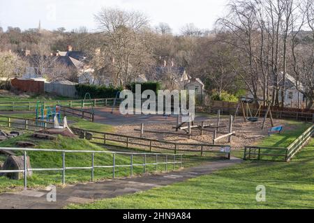 The Quarry Park in South Gosforth, Newcastle upon Tyne, UK. A children's play area with a sand surface in a public park. Stock Photo