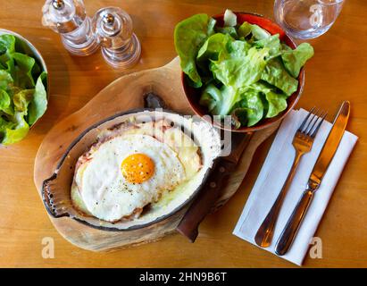 Swiss cheese crust with fried egg Stock Photo