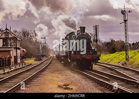 LMS Class 2 2-6-0 No.46521 heading north at Quorn station on the Great Central Railway Stock Photo