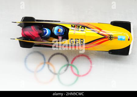 Beijing, China. 15th Feb, 2022. Bobsleigh: Olympics, two-man bobsleigh, men, 3rd run at Yanqing National Sliding Centre, Johannes Lochner and Florian Bauer in the ice track. Credit: Michael Kappeler/dpa/Alamy Live News Stock Photo