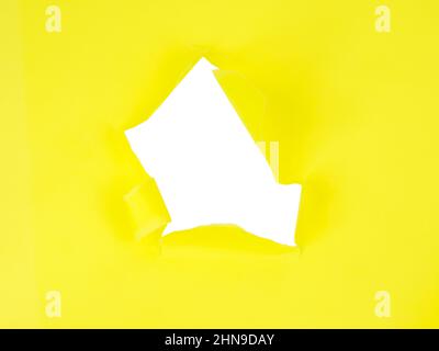 Yellow torn sheet of paper with whole space for text Stock Photo