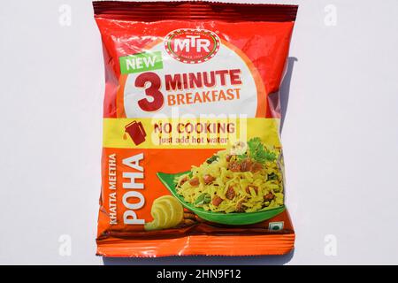 MTR branded Instant Khatta meetha Poha breakfast item. Mtr Poha packet isolated on white background. Instant food flattened rice or rice flakes vegeta Stock Photo