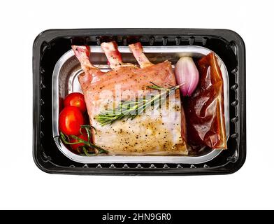 mini smoked sausages in plastic tray isolated on white. Stock Photo
