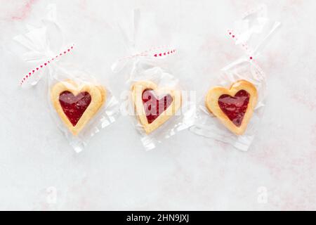 Heart shaped Linzer cookies wrapped in cellophane packages, for Valentine's Day. Stock Photo