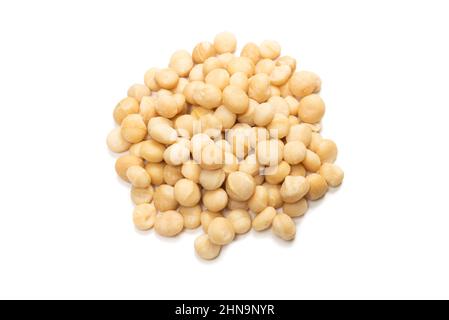 Macadamia nuts isolated on white background. Top view. Stock Photo