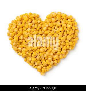 Fresh cooked yellow corn seeds in heart shape isolated on white background Stock Photo