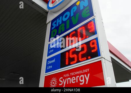 Bridport, Dorset, UK.  15th February 2022. Fuel prices are increasing again.  The sign at the ESSO petrol station on the A35 at Bridport in Dorset is showing the price for unleaded petrol at 150.9p per litre and diesel at 152.9p per litre. Picture Credit: Graham Hunt/Alamy Live News Stock Photo