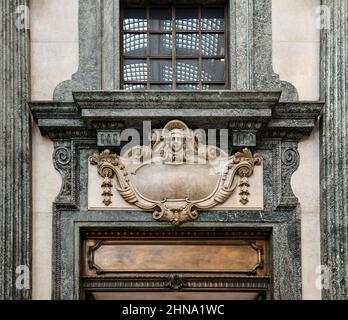Detail of an entrance of Galleria San Federico shopping arcade decorated with bas-reliefs and polychrome marble, Turin, Piedmont, Italy Stock Photo