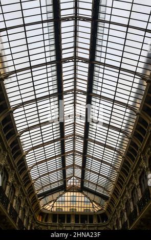 Low angle view of the glass roof of the Galleria Subalpina (1873), a covered shopping gallery located in the historic centre of Turin, Piedmont, Italy Stock Photo