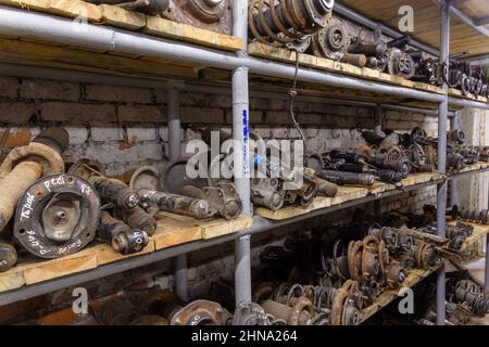 Used car parts on the factory shelf. Used auto parts for sale in a