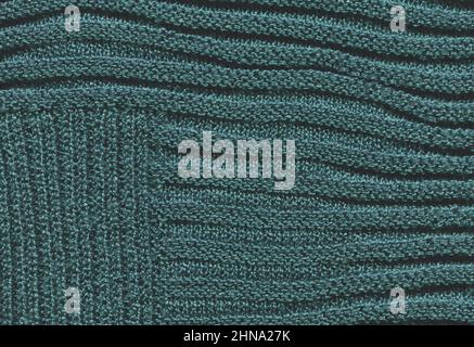 Turquoise texture of light knitted warm fabric. Scandinavian mint knitted rustic wool material background. Stock Photo