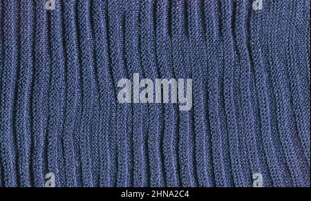 Knitted blue  texture surface close up. Background from softness blue  blanket. Stock Photo