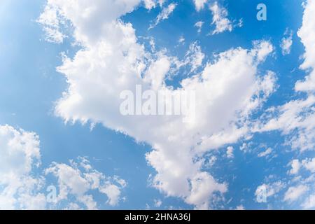 white cumulus clouds in a blue sky. Beautiful natural background Stock Photo