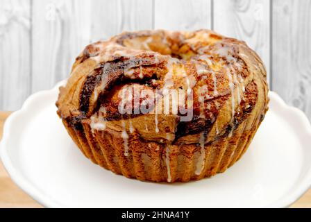 A Marbled Bunt Cake with Glaze Drizzled on Top Stock Photo