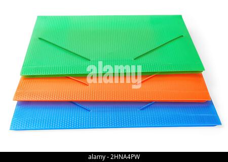 Three multi-colored folders for papers front view. Isolated on white, clipping path included Stock Photo
