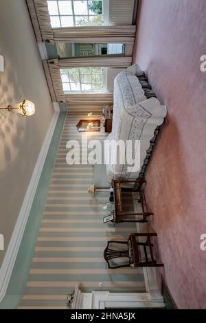 Newmarket, Suffolk - October 23 2014: Bedroom within grand traditional historic British home. Stock Photo