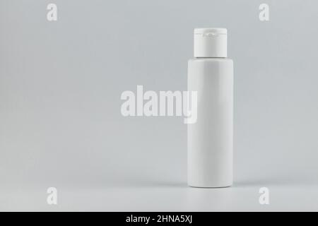 Skincare and cosmetology mockup with copy space. Unbranded white plastic flacon for cosmetics products. Branding identity template for text and design Stock Photo