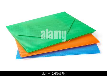 Three multi-colored folders for papers angle view. Isolated on white, clipping path included Stock Photo