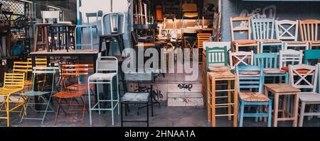 old colorful chairs in a second hand shop Stock Photo