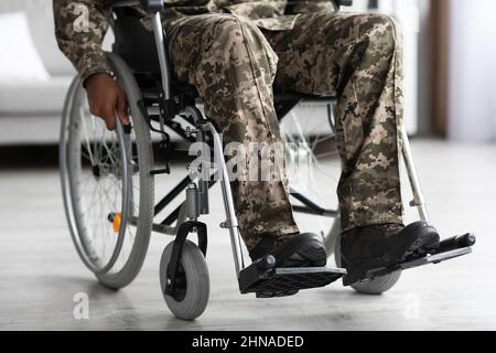 Legs of disabled african american military man in wheelchair Stock Photo