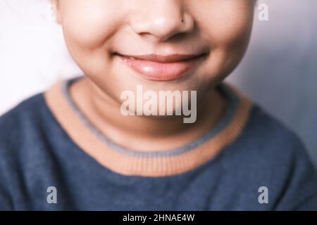 Portrait of child girl looking the camera and laughing.  Stock Photo