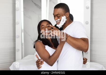 Portrait Of Cheerful African American Couple Having Fun In Bathroom Stock Photo