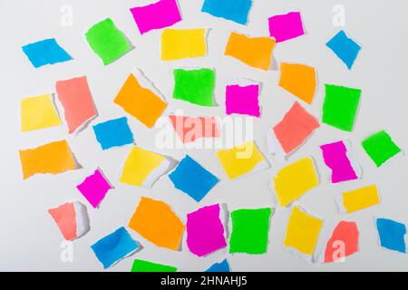 Neon colour torn paper pieces isolated on white background. Stock Photo