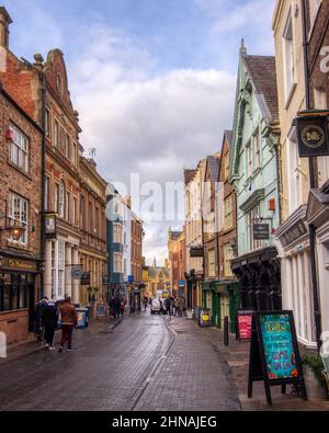A view of the shops and pubs along Saddler Street in Durham towards the market square Stock Photo