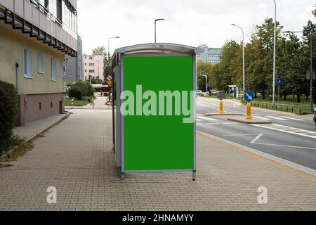 Chromakey banner on the background of a city street. Background with space for text. Blank banner for advertising in the city on a sunny summer day Stock Photo