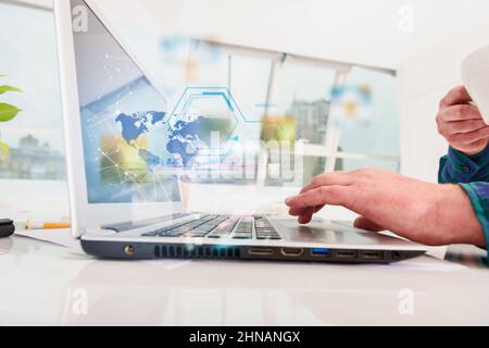 Man works with laptop with internet streaming service Stock Photo