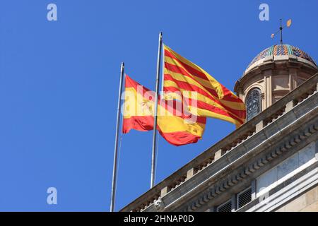 Two flags - spain and catalonia fixed on roof Stock Photo