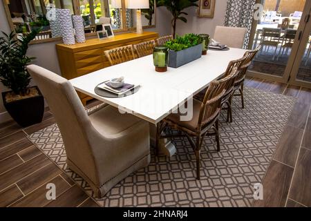 Dining Area With Eight Chairs On Decorator Rug Stock Photo