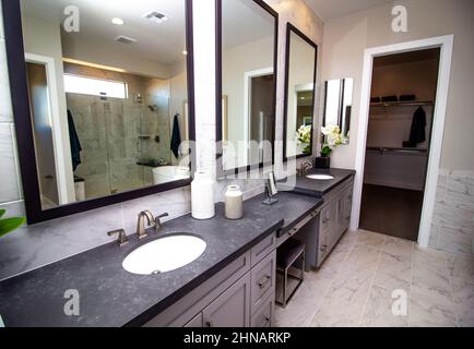 Master Bathroom With Dual Vanities And Makeup Area Stock Photo