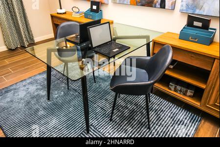 Glass Desk Table With Two Laptops In Home Office Stock Photo