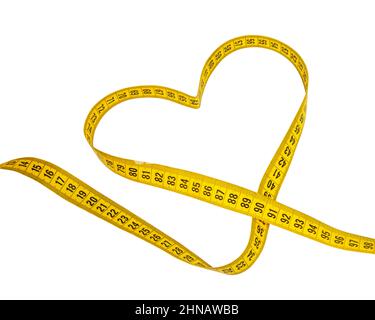 Yellow heart tape measure isolated on the white background Stock Photo