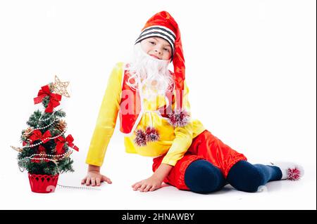 A baby dressed as a elf. isolated. Santa's helper. boy in suit of dwarf or elf Stock Photo