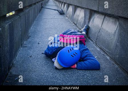 Young man injured in e-scooter accident Stock Photo