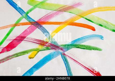 Colorful hand drawn painted careless strokes on light paper. Abstract background Stock Photo