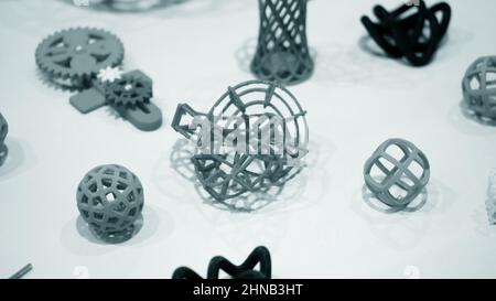 Many abstract models bright colorful objects printed on a 3d printer ...