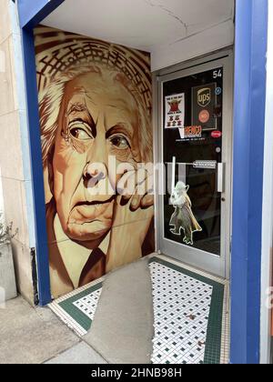 Asheville, North Carolina, USA. 12th Feb, 2022. A graphic based on a 1954 newspaper portrait of architect Frank Lloyd Wright is on the front of a graphics business in downtown Asheville, North Carolina, Saturday February 12, 2022. (Credit Image: © Mark Hertzberg/ZUMA Press Wire) Stock Photo