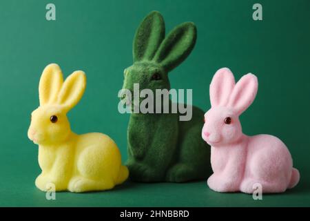 Cute Easter bunnies on green background Stock Photo