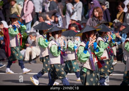 Nagoya, Japan – October 20, 2019: The parade of children wearing traditional historical costumes with flutes at the autumn Nagoya festival. Japan Stock Photo