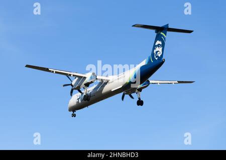 Seatac, WA, USA - February 11, 2022; Horizon Airlines Bombardier flight in Alaska colors with eskimo logo on tail Stock Photo