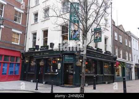 London, UK. The Duke of York public house in Fitzrovia with a hanging sign and cornerpiece bearing Prince Andrew's image. Stock Photo