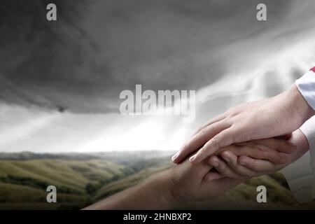 Jesus Christ gave his help to his follower with dramatic background Stock Photo