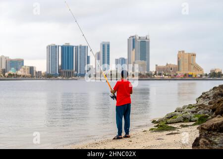 Fisherman on Al-Zawra Beach in Ajman Stock Photo