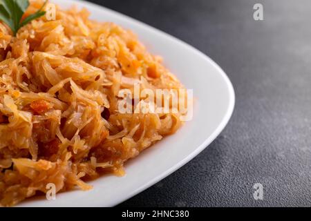 Traditional Homemade Stewed cabbage on white plate Stock Photo