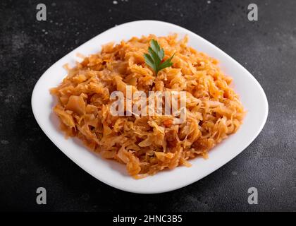 Traditional Homemade Stewed cabbage on white plate Stock Photo