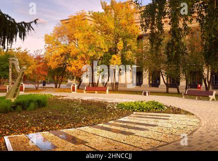 Novosibirsk / Siberia/Russia-09.20: Theater square in autumn. A square with a harp, bright autumn plants and flowers, the Opera and ballet theater bui Stock Photo