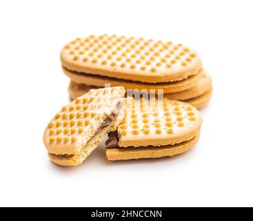 Sweet sandvich cookies. Biscuits with cocoa cream filling isolated on a white background. Stock Photo